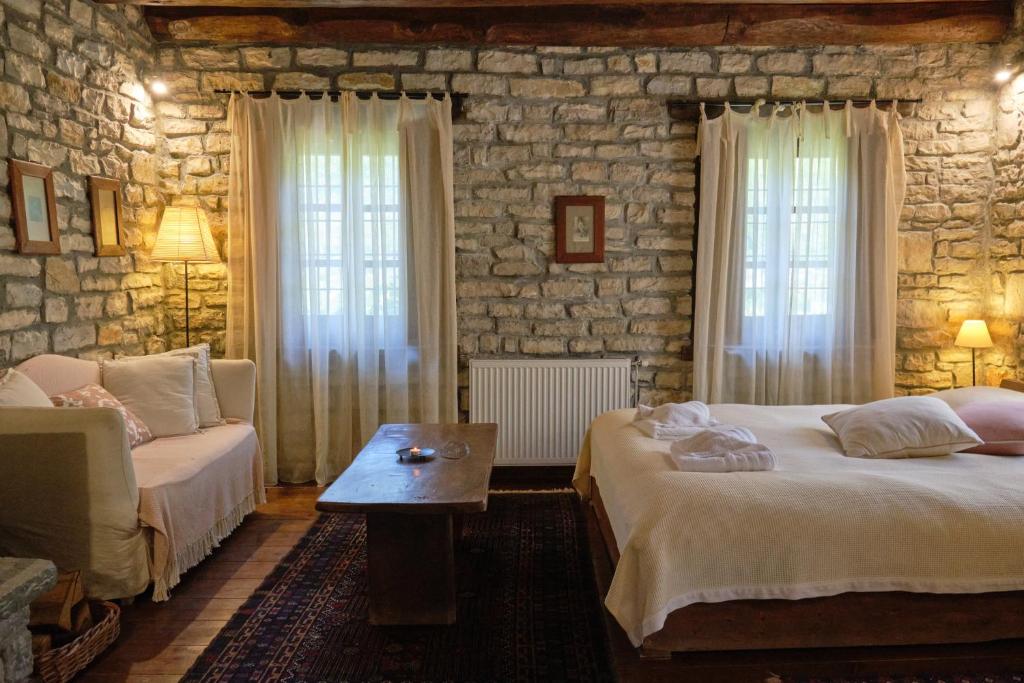 A bed or beds in a room at Arhontiko Aristis