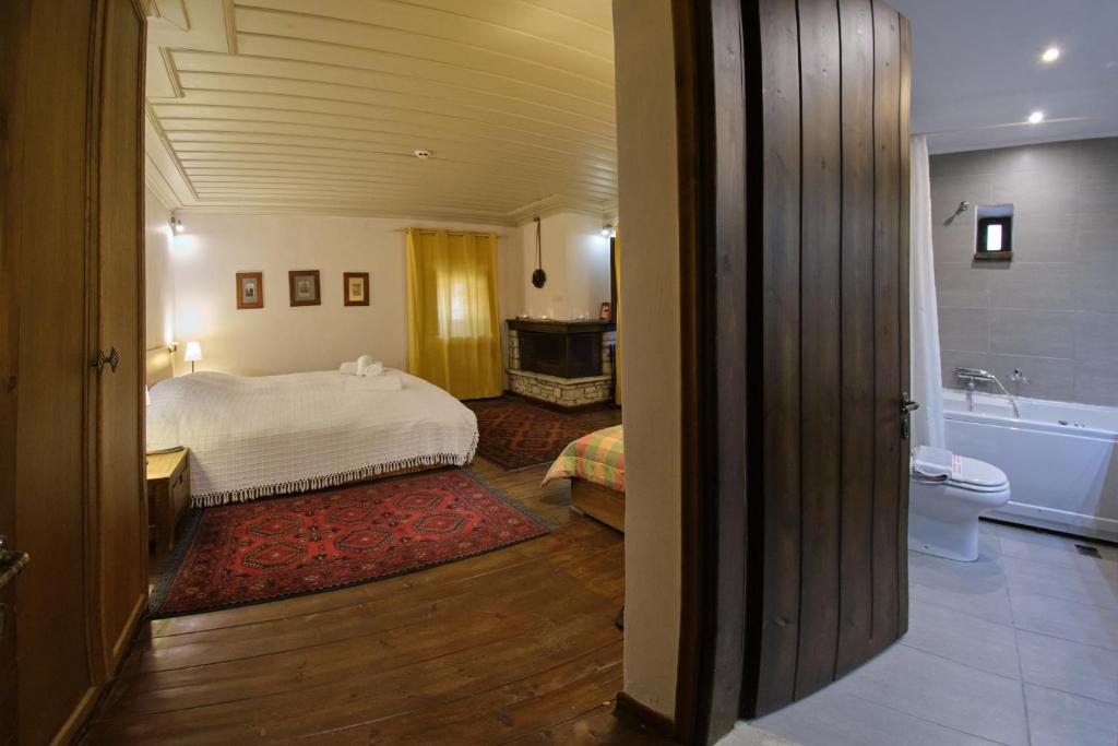 A bed or beds in a room at Arhontiko Aristis