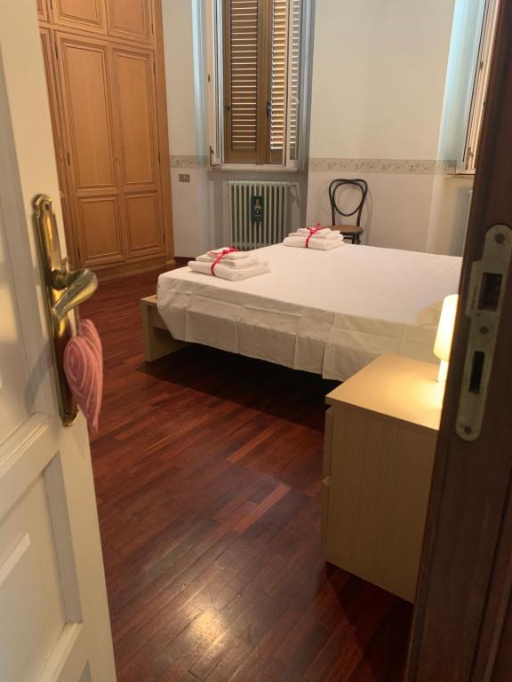 a bedroom with a bed and a wooden floor at di Anna, Matera in Centro in Matera
