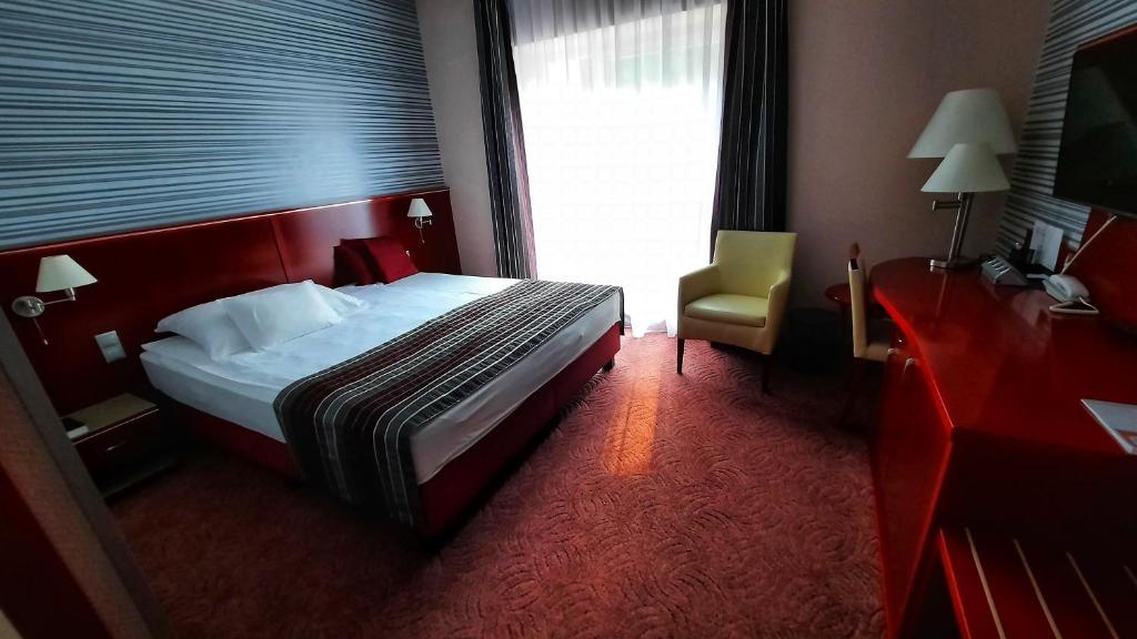 Postel nebo postele na pokoji v ubytování Veronika Hotel