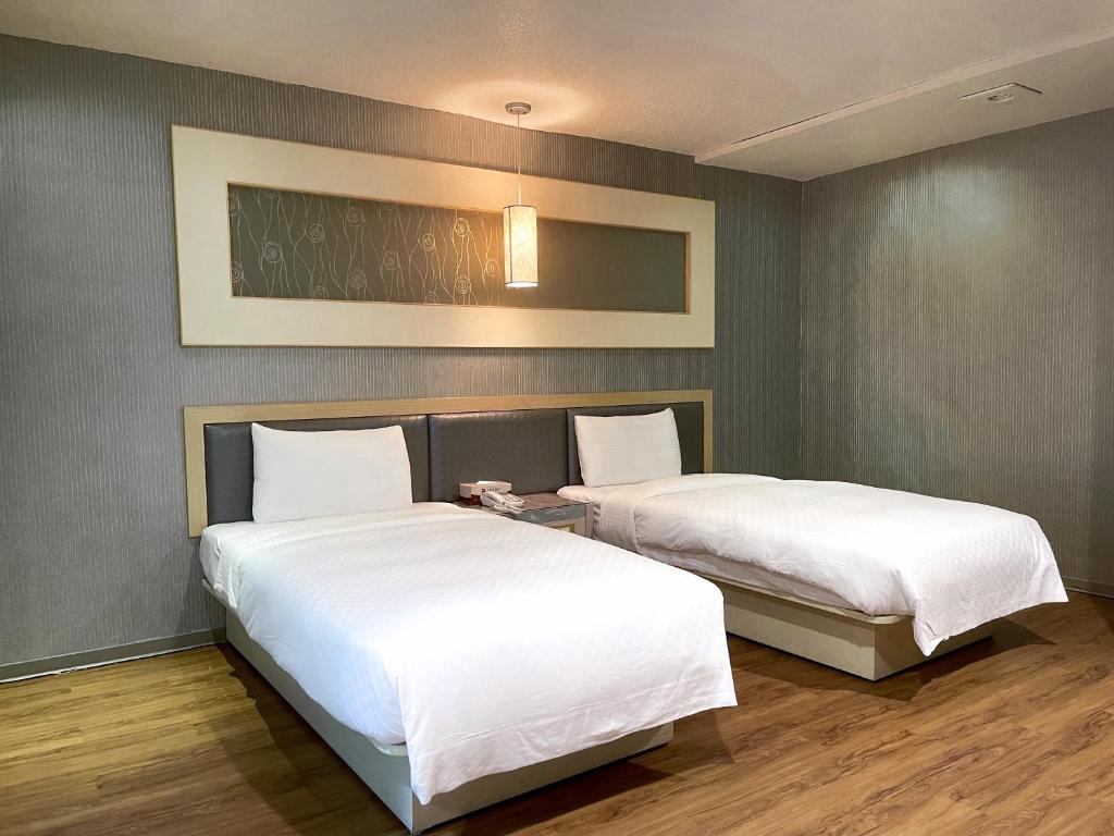 Postel nebo postele na pokoji v ubytování Beidoo Hotel