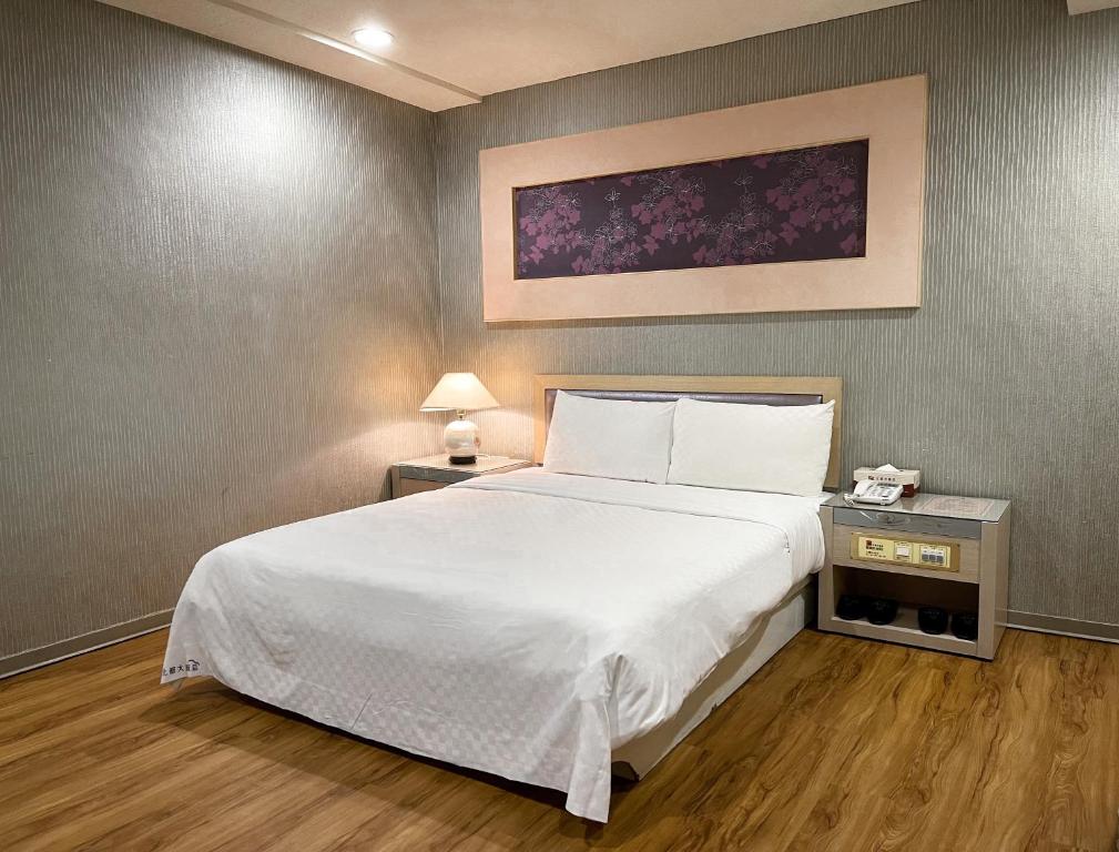 Postel nebo postele na pokoji v ubytování Beidoo Hotel