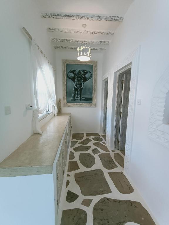 Postel nebo postele na pokoji v ubytování Watamu Neverland Villas
