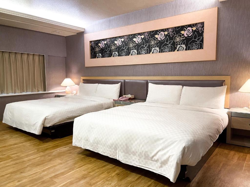 Postel nebo postele na pokoji v ubytování Beidoo Hotel