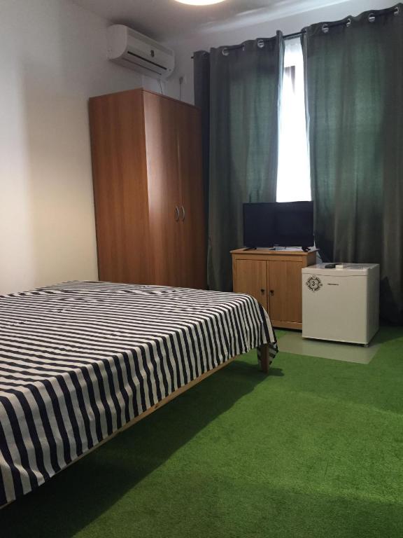 Postel nebo postele na pokoji v ubytování Vila ALBA AREAL