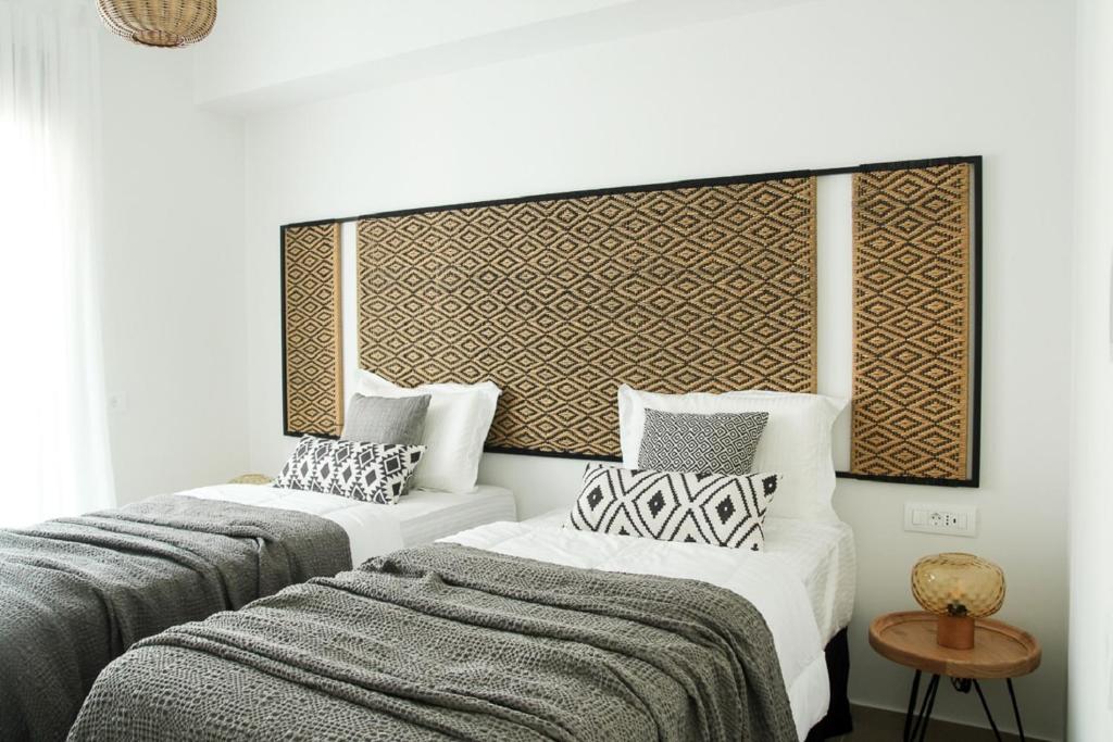 Postel nebo postele na pokoji v ubytování Elounda Katikia Luxury Living