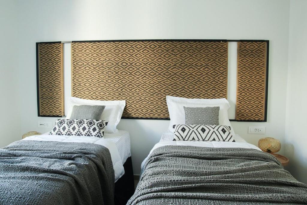 Postel nebo postele na pokoji v ubytování Elounda Katikia Luxury Living