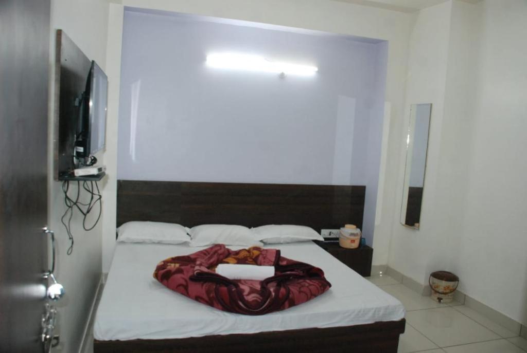 Postel nebo postele na pokoji v ubytování Hotel Chouhan Paradise
