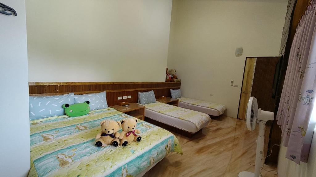 Postel nebo postele na pokoji v ubytování 鄉間雅築休閒民宿Country Villa Homestay