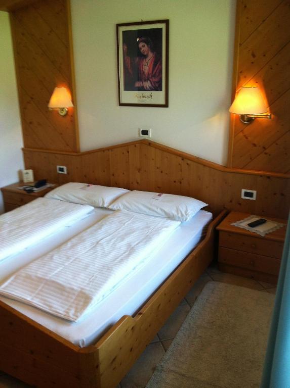 Postel nebo postele na pokoji v ubytování Piccolo Hotel Sciliar