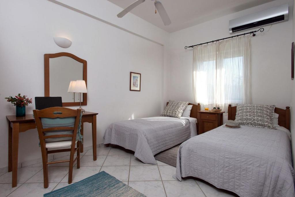 Łóżko lub łóżka w pokoju w obiekcie Panorama Villas Corfu 3 Bedroom Villa Sea View With Private Pool