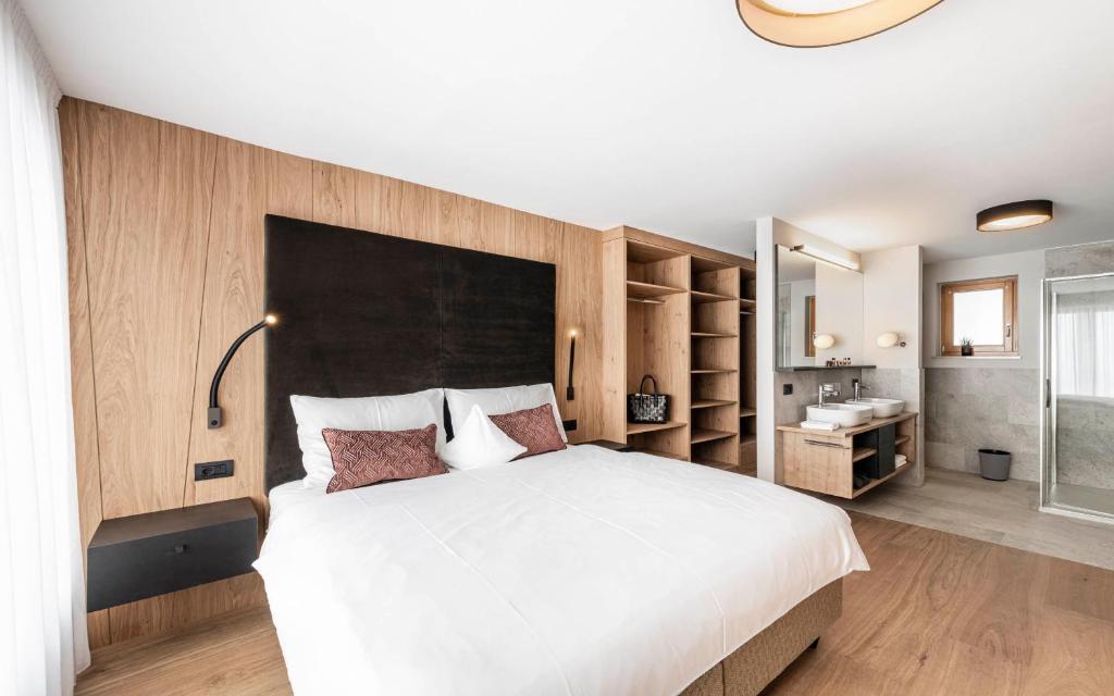 Łóżko lub łóżka w pokoju w obiekcie LaMonte Premium Apartments by Feuerstein