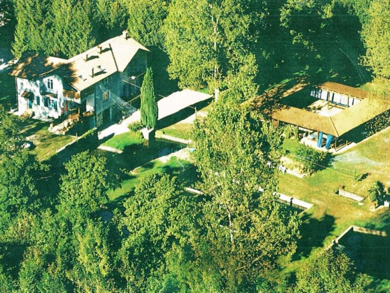 an aerial view of a large house in the woods at Agriturismo S.Lucia in Roccaforte Mondovì