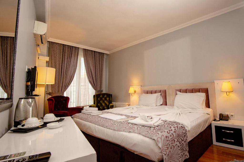 Postel nebo postele na pokoji v ubytování SRF Hotel