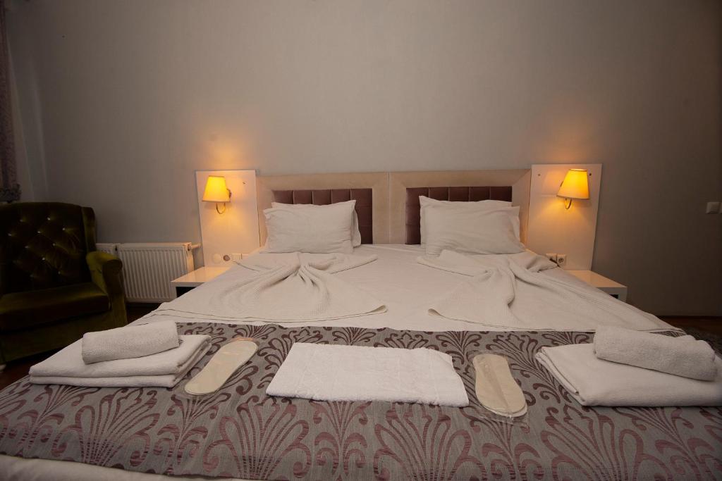 Postel nebo postele na pokoji v ubytování SRF Hotel