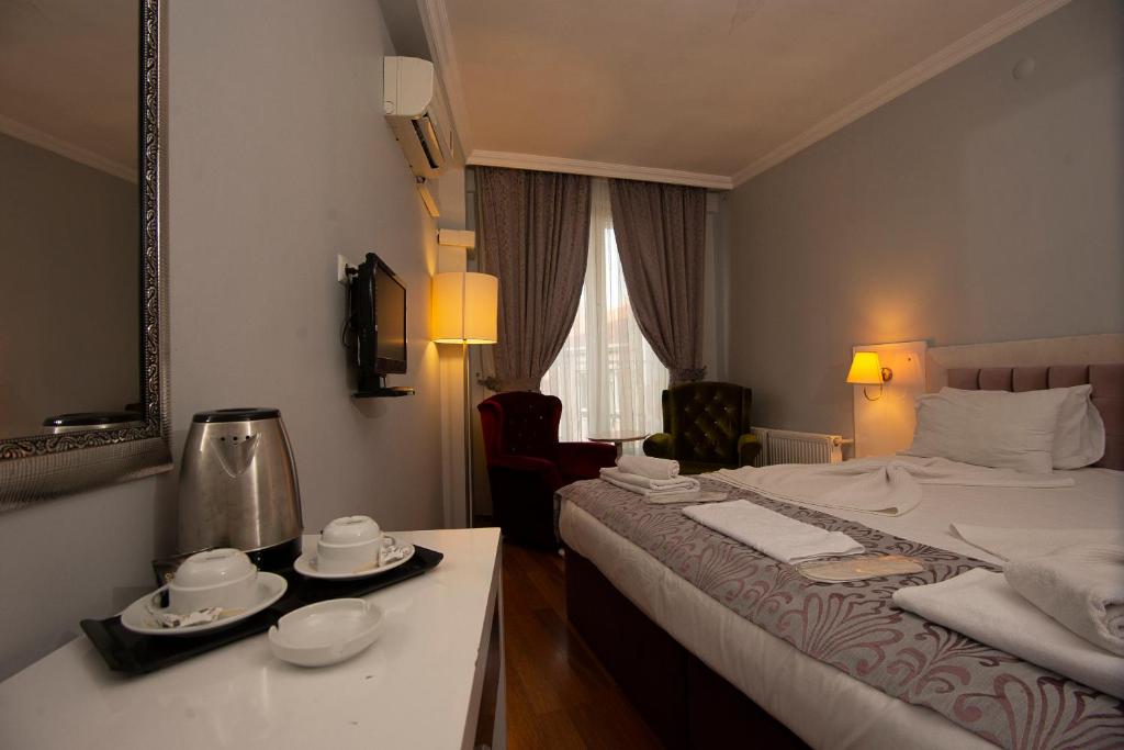 Postel nebo postele na pokoji v ubytování SRF Hotel