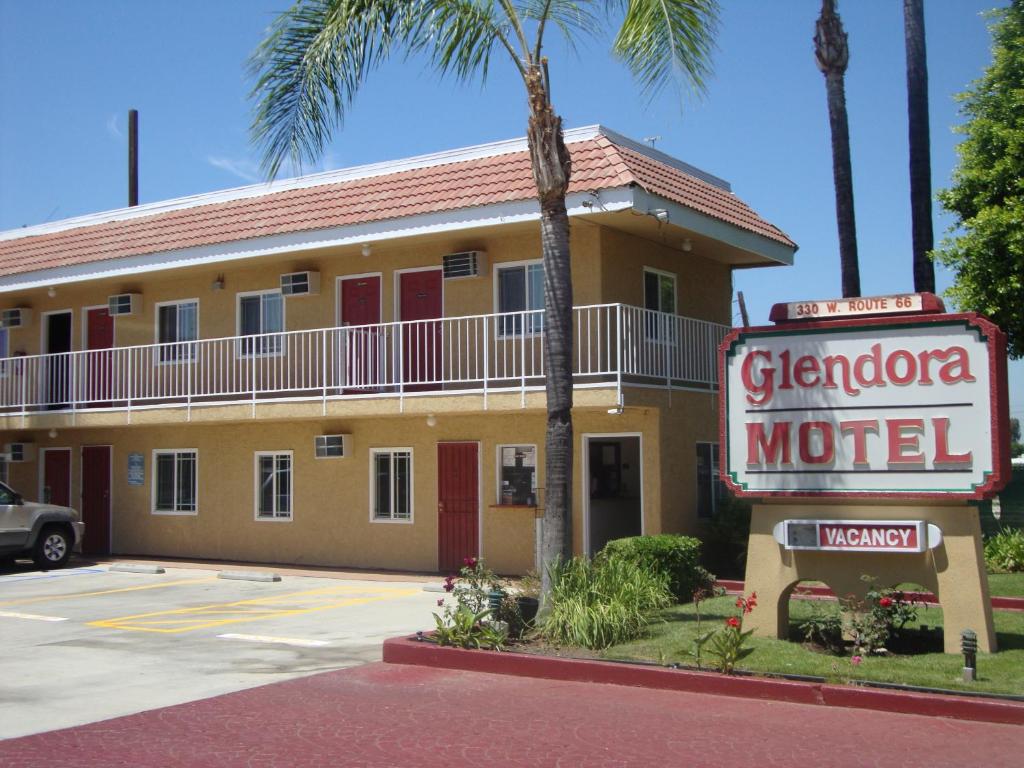 a sign for a german motel in front of a building at Glendora Motel in Glendora