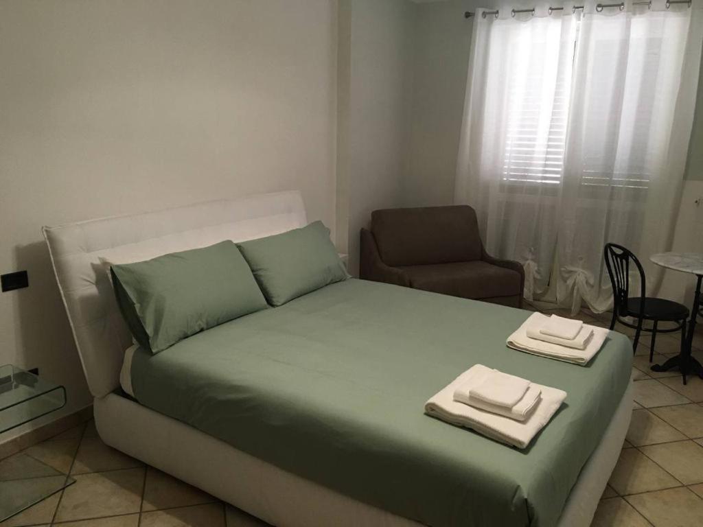 a bedroom with a bed with two towels on it at B&B La Fontana in Mirabello Sannitico