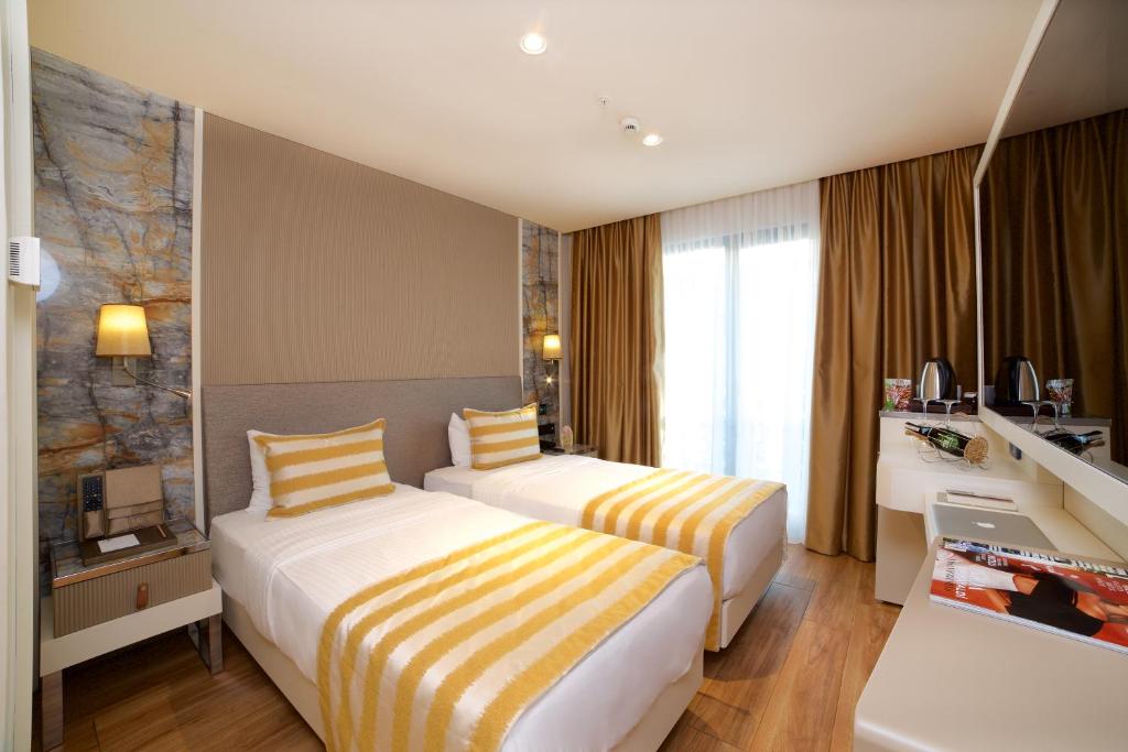 Postel nebo postele na pokoji v ubytování Icon Hotel Taksim