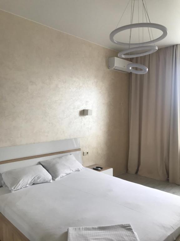 Postel nebo postele na pokoji v ubytování Apart Assistant on Smart Plaza