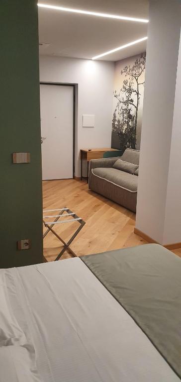 Postel nebo postele na pokoji v ubytování HOTEL - BAR DA NATALE