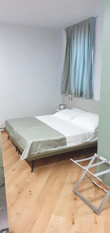 Postel nebo postele na pokoji v ubytování HOTEL - BAR DA NATALE
