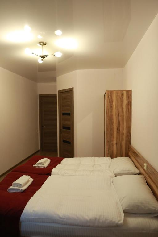 A bed or beds in a room at Paramount Kazbegi