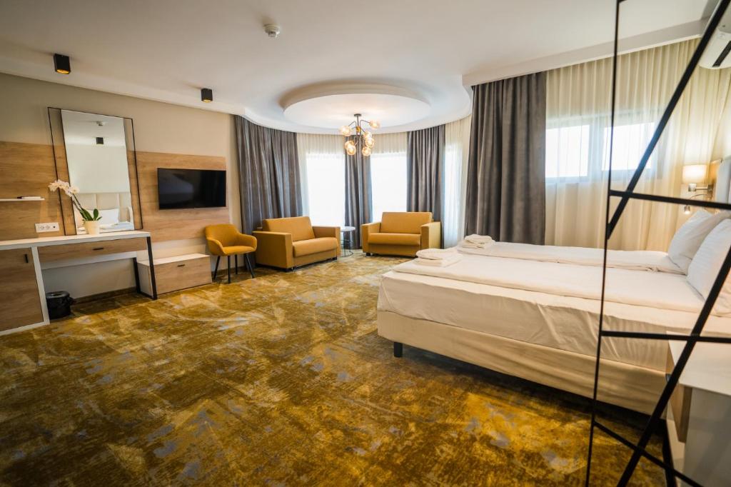 Postel nebo postele na pokoji v ubytování Pensiunea Palace