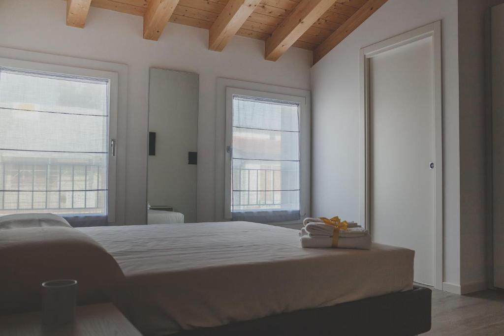 A bed or beds in a room at Terra Ferma Rooms&More