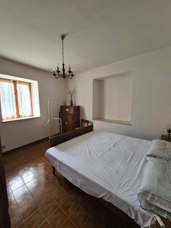 Postel nebo postele na pokoji v ubytování Appartmento Rustico Montagna Val Maira Castellaro