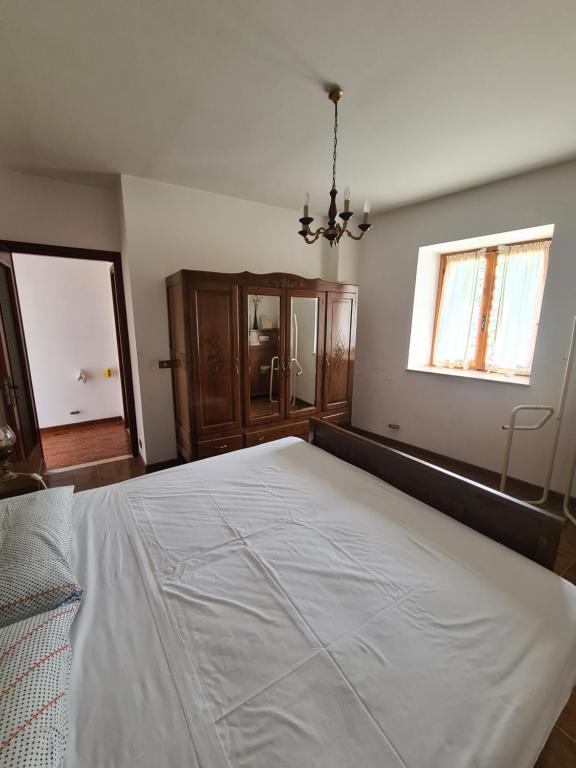 Postel nebo postele na pokoji v ubytování Appartmento Rustico Montagna Val Maira Castellaro
