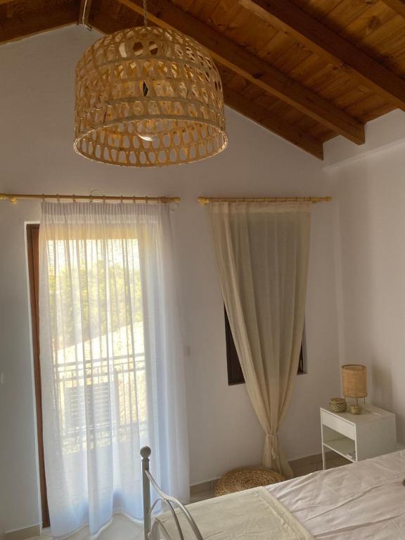 Postel nebo postele na pokoji v ubytování Celestia Apartments