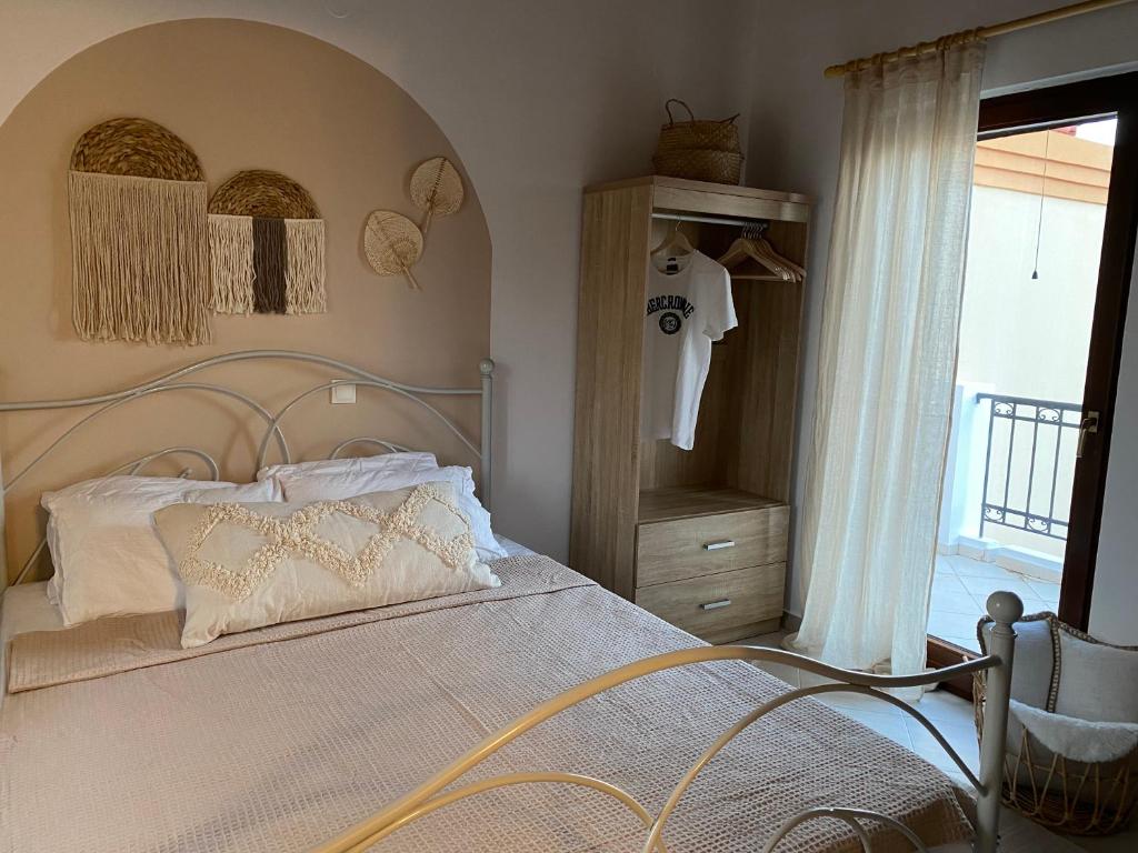 Postel nebo postele na pokoji v ubytování Celestia Apartments