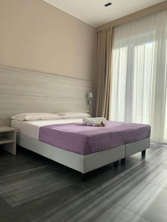 Postel nebo postele na pokoji v ubytování B&B Margherita