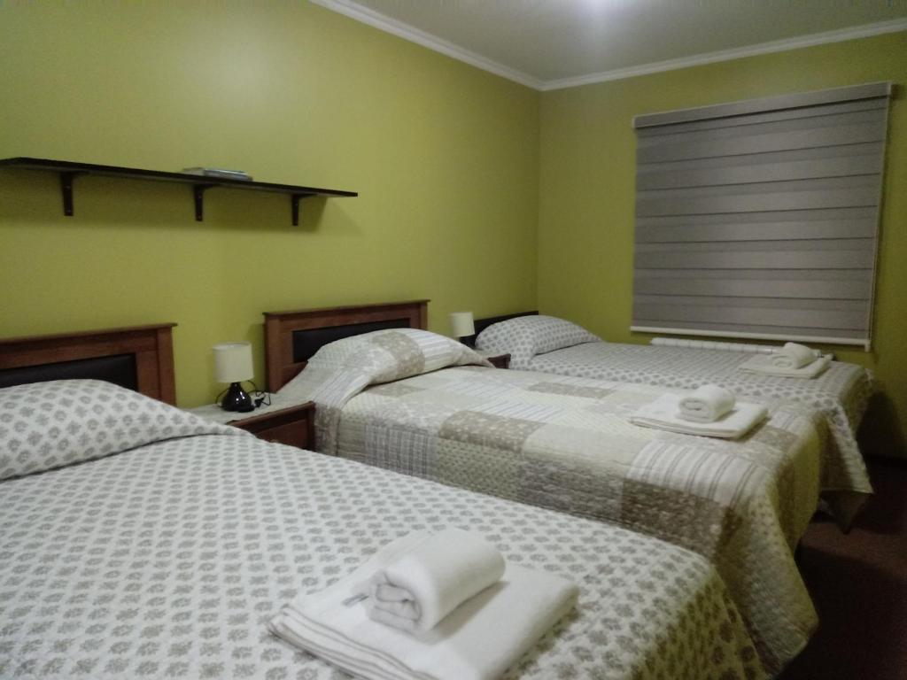 Postel nebo postele na pokoji v ubytování VALYAK rent apart hotel - Servicios Integrales