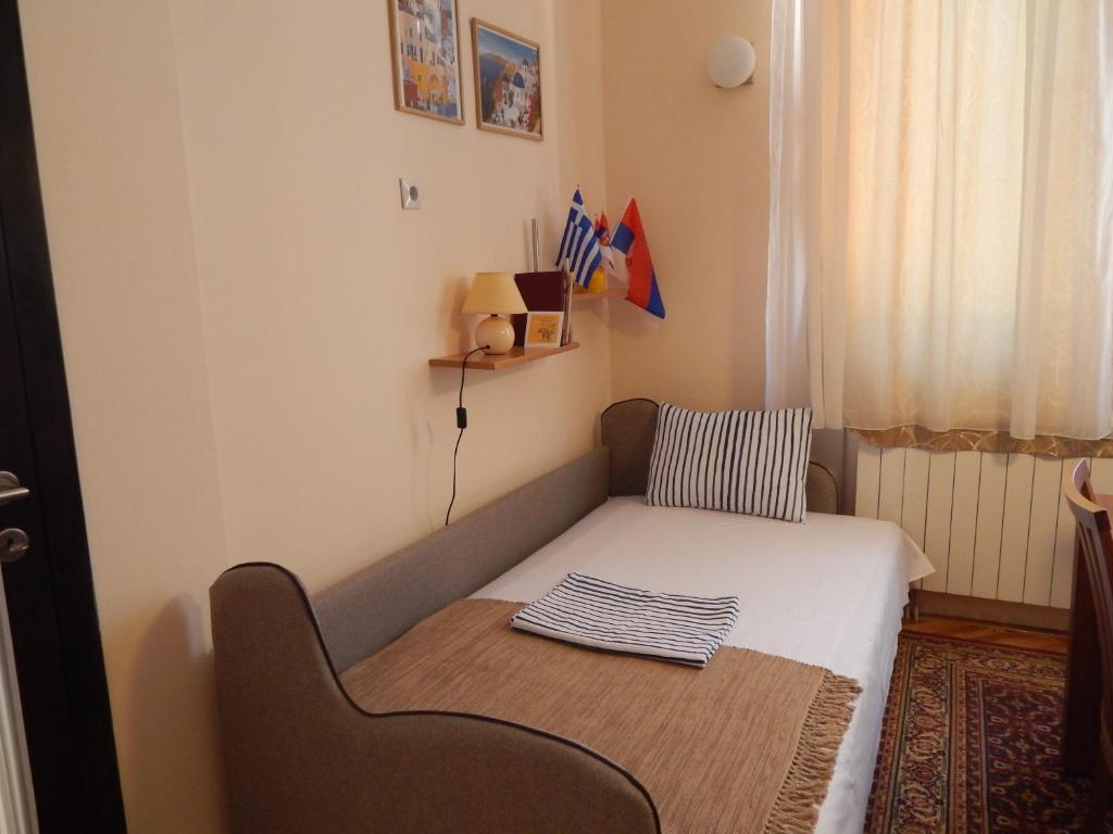 Postel nebo postele na pokoji v ubytování Apartmani Jelica FREE PARKING