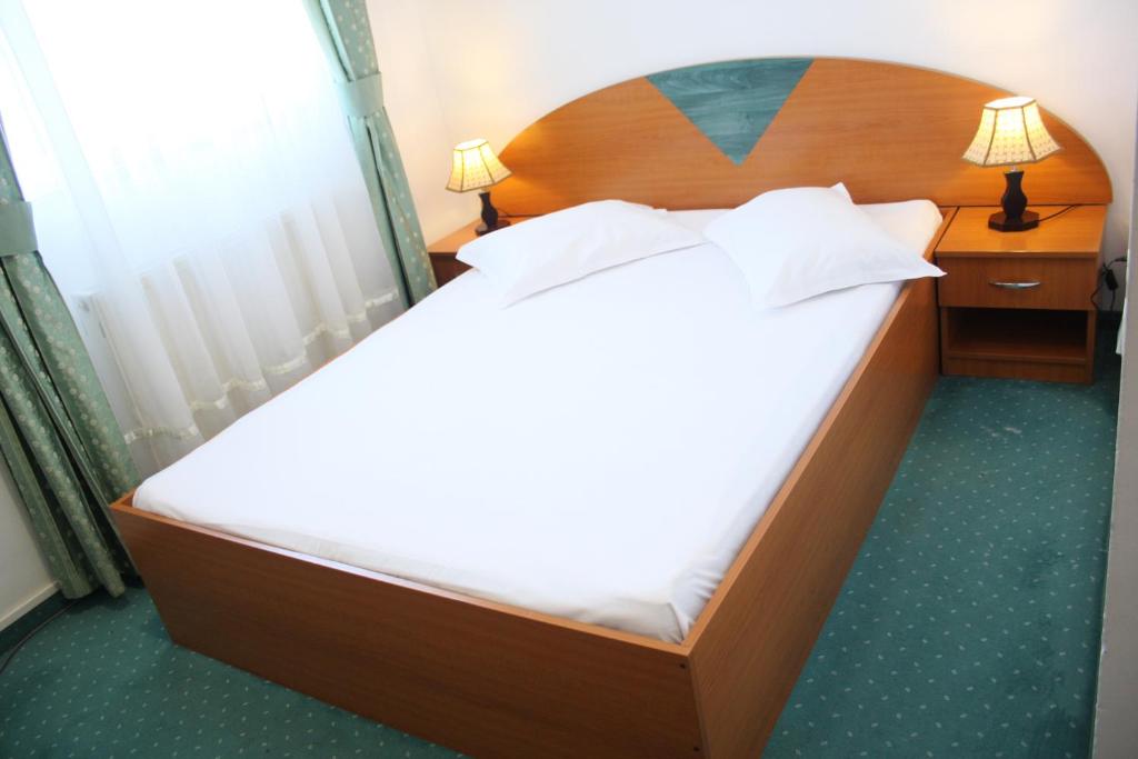 Postel nebo postele na pokoji v ubytování Hotel Sir Orhideea