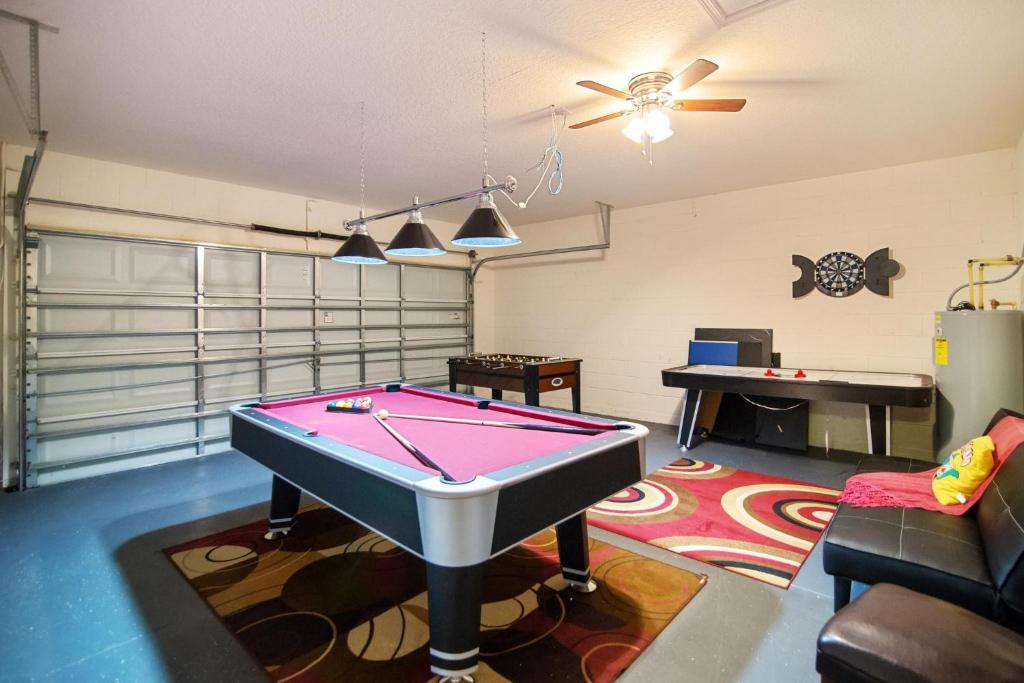a living room with a pool table in it at 1115CPB-Cypress Pointe in Davenport