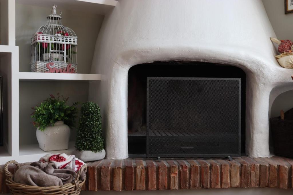 a living room with a tv in a fireplace at La Esquina de Castroviejo in Logroño