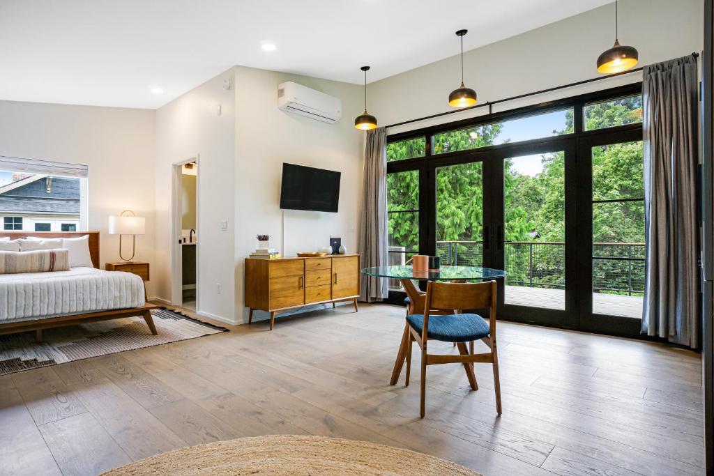 a bedroom with a bed and a glass table at The Treehouse in Seattle