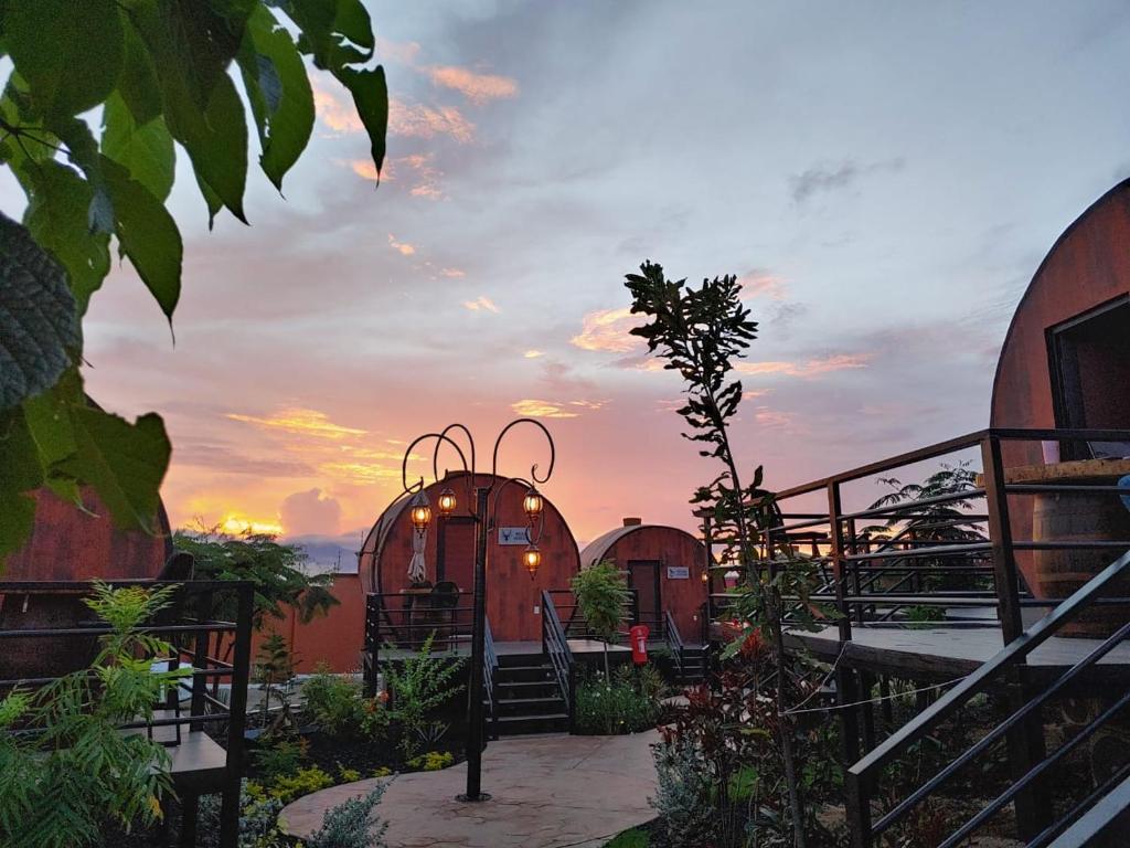 a view of a house with a sunset in the background at Casa Naiyari in Tepic