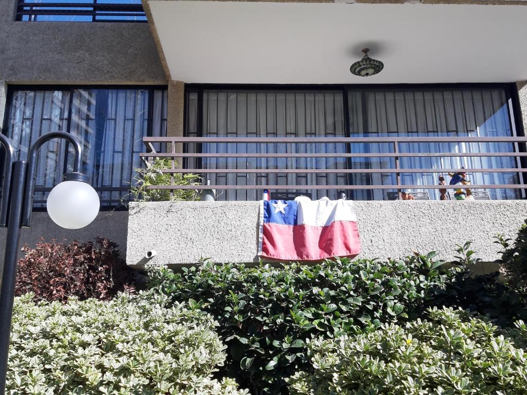 an american flag is hanging on a fence at Casadenise in Santiago