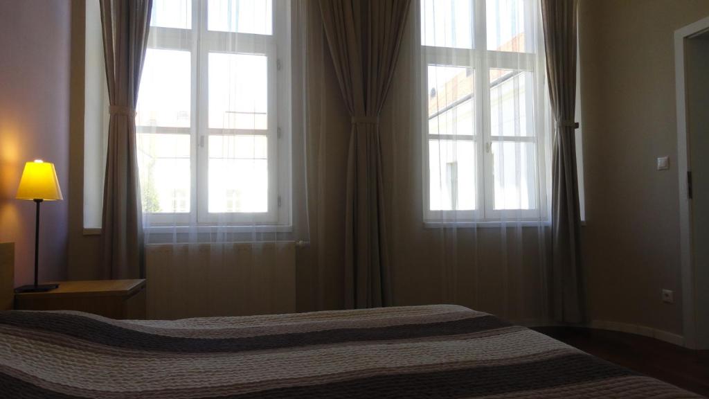 Posteľ alebo postele v izbe v ubytovaní Horvath Villa Apartman