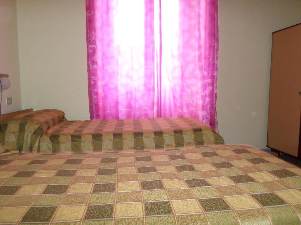 Postel nebo postele na pokoji v ubytování Hotel Aurora