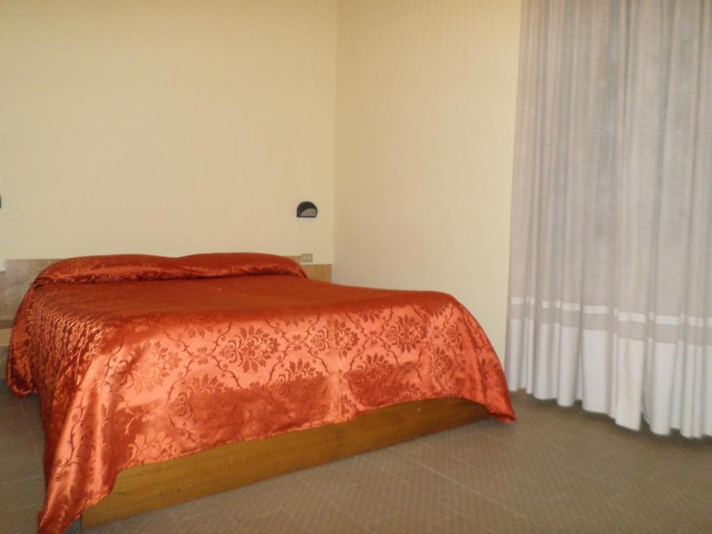 Postel nebo postele na pokoji v ubytování Hotel Aurora