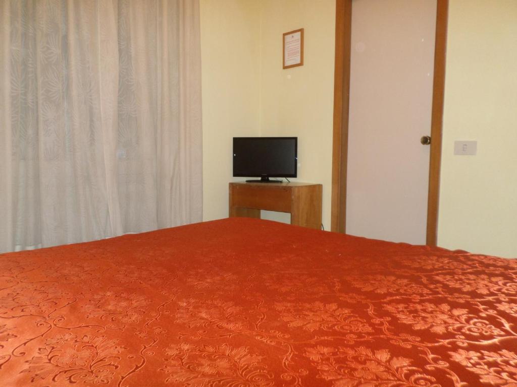 TV a/nebo společenská místnost v ubytování Hotel Aurora