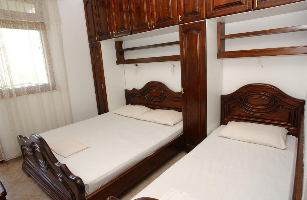 Postel nebo postele na pokoji v ubytování Rooms & Apartments Anka