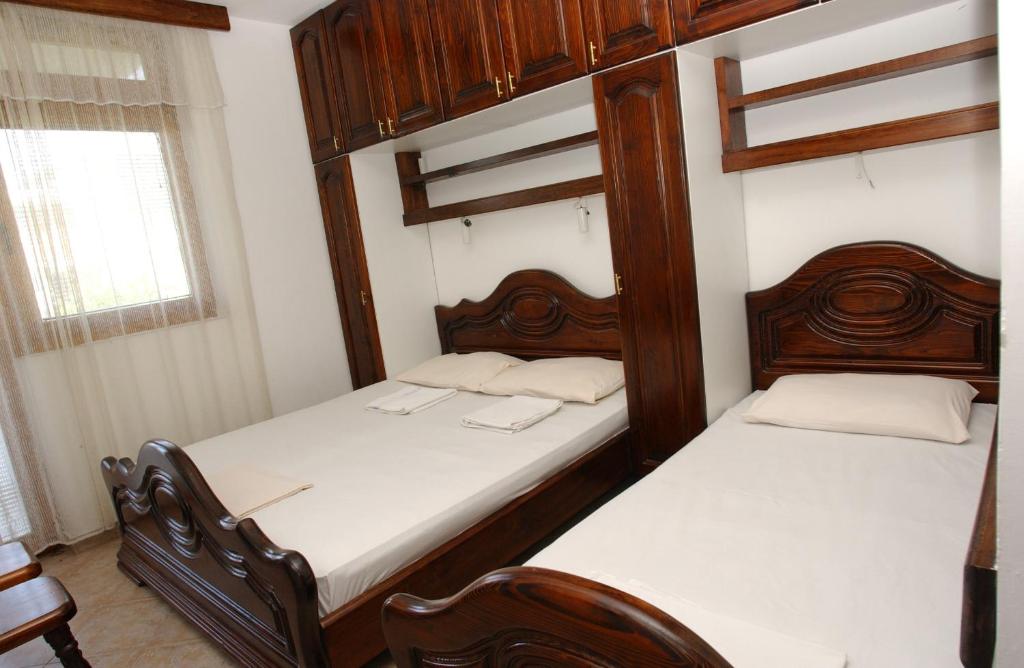 Postel nebo postele na pokoji v ubytování Rooms & Apartments Anka