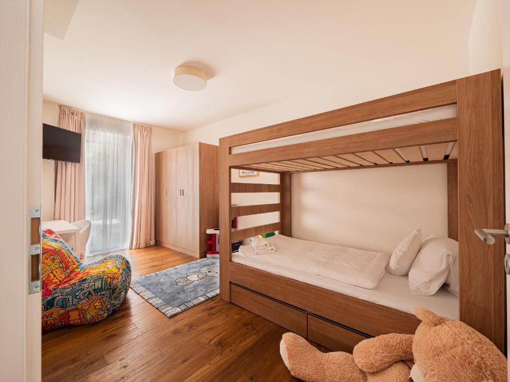Postel nebo postele na pokoji v ubytování Apartmány Resort Vrchlabí