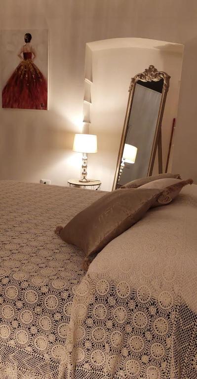 Posteľ alebo postele v izbe v ubytovaní LA CASA SOTTO IL CASTELLO